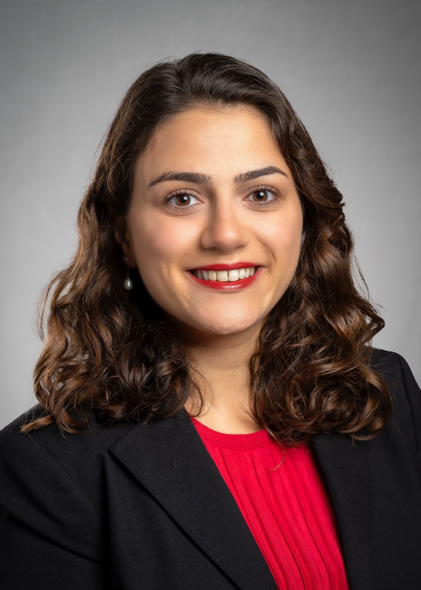Portrait of Dr. Irem Sonmez, smiling, wearing a black blazer